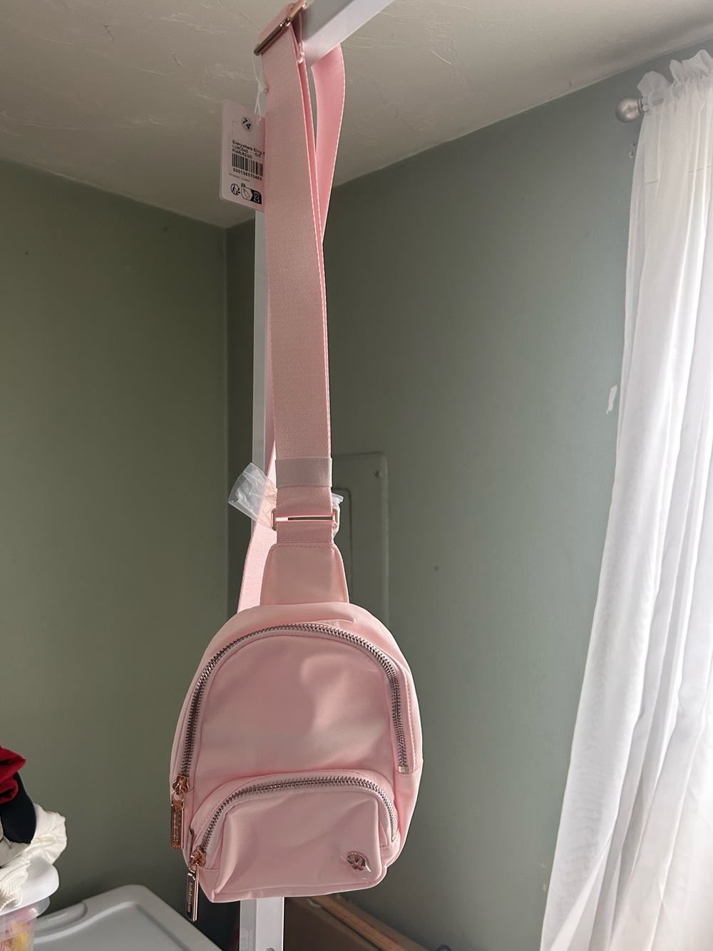 Lululemon Everywhere Small Sling Bag in the color Pink Pearl w/ Rose gold